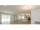 Open concept kitchen with island, stainless steel appliances, and tile flooring at 2368 Juniper Berry Dr, Minneola, FL 34715