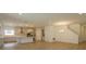 Open living room with wood-look tile flooring and neutral color palette at 2368 Juniper Berry Dr, Minneola, FL 34715