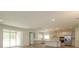 Spacious kitchen with island, stainless steel appliances, and white cabinets at 2368 Juniper Berry Dr, Minneola, FL 34715