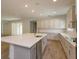 Open kitchen with large island and stainless steel appliances at 2368 Juniper Berry Dr, Minneola, FL 34715