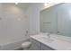 Clean bathroom, bathtub, toilet and vanity with white countertop at 2368 Juniper Berry Dr, Minneola, FL 34715
