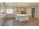 Spacious kitchen with large island and stainless steel appliances at 2368 Juniper Berry Dr, Minneola, FL 34715
