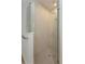 Large walk-in shower with glass enclosure and neutral tile at 2368 Juniper Berry Dr, Minneola, FL 34715
