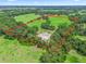 Aerial view of a large lot with a riding arena at 2027 Cr 232, Wildwood, FL 34785