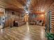 Spacious living room with hardwood floors and log cabin style at 2027 Cr 232, Wildwood, FL 34785