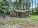 Rustic barn with attached fenced animal enclosure at 2027 Cr 232, Wildwood, FL 34785
