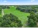 Aerial view showing expansive pastures and lush greenery at 2027 Cr 232, Wildwood, FL 34785