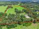 Aerial view showcasing a sizable lot with open pasture at 2027 Cr 232, Wildwood, FL 34785