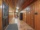 Rustic entryway with wood paneling and multiple doors at 2027 Cr 232, Wildwood, FL 34785
