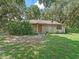 Charming single story home with wood siding and a large yard at 2027 Cr 232, Wildwood, FL 34785