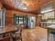 Kitchen with stainless steel appliances and rustic wooden cabinets at 2027 Cr 232, Wildwood, FL 34785