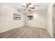 Simple bedroom with ceiling fan and carpet flooring at 1113 Oakland Cir, Tavares, FL 32778
