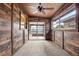 Spacious bonus room with wood-paneled walls and sliding doors at 1113 Oakland Cir, Tavares, FL 32778