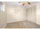 Bedroom with ceiling fan, carpet flooring, and mirrored closet doors at 1113 Oakland Cir, Tavares, FL 32778