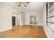 Spacious sunroom with wood flooring and access to backyard at 1113 Oakland Cir, Tavares, FL 32778