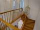 Upper level view of the elegant wooden staircase at 415 Se 123Rd Street Rd, Ocala, FL 34480