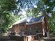 Back of house showcasing brick facade and landscaping at 415 Se 123Rd Street Rd, Ocala, FL 34480