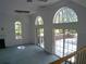 Living room with sliding glass doors to patio at 415 Se 123Rd Street Rd, Ocala, FL 34480