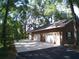 Attached three-car brick garage with ample parking space at 415 Se 123Rd Street Rd, Ocala, FL 34480