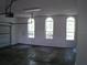 Large garage with three windows and ample storage at 415 Se 123Rd Street Rd, Ocala, FL 34480