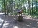Stone well with wooden cover in a wooded area at 415 Se 123Rd Street Rd, Ocala, FL 34480