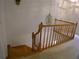 Upstairs hall with wooden staircase and chandelier at 415 Se 123Rd Street Rd, Ocala, FL 34480