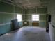 Unfinished workshop with two windows and a sink at 415 Se 123Rd Street Rd, Ocala, FL 34480