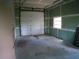 Unfinished workshop with garage door and window at 415 Se 123Rd Street Rd, Ocala, FL 34480