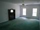 Spacious bedroom with fireplace and teal carpeting at 415 Se 123Rd Street Rd, Ocala, FL 34480