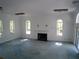 Large living room with fireplace and lots of natural light at 415 Se 123Rd Street Rd, Ocala, FL 34480