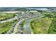 Aerial view of the home and surrounding neighborhood by the lake at 1163 Haines Dr, Winter Haven, FL 33881