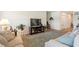 Living room features a large TV and plenty of natural light at 1163 Haines Dr, Winter Haven, FL 33881