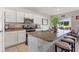 Spacious kitchen island with granite countertops and breakfast bar at 1163 Haines Dr, Winter Haven, FL 33881