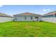 Spacious backyard with home view and grassy area at 1163 Haines Dr, Winter Haven, FL 33881