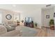 Living room featuring neutral-toned couches and rug at 1163 Haines Dr, Winter Haven, FL 33881