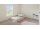Small bedroom with a single bed, window, and small table at 1163 Haines Dr, Winter Haven, FL 33881
