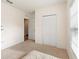 Spacious bedroom with double door closet and window at 1163 Haines Dr, Winter Haven, FL 33881
