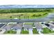 Aerial view of houses near a lake, showcasing the community and waterfront at 1163 Haines Dr, Winter Haven, FL 33881