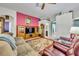 Bright and airy living room with comfortable seating and views into adjacent rooms at 3914 Scarborough Ct, Clermont, FL 34711