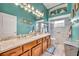 Elegant bathroom boasts dual vanities, a large shower, and updated fixtures at 3914 Scarborough Ct, Clermont, FL 34711