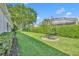 Private backyard oasis with mature trees and well-manicured lawn at 3914 Scarborough Ct, Clermont, FL 34711