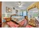 Large bedroom with wood floors and access to private patio at 3914 Scarborough Ct, Clermont, FL 34711