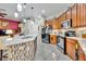 Modern kitchen with granite countertops, stainless steel appliances and an island at 3914 Scarborough Ct, Clermont, FL 34711