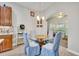 Kitchen nook with glass-top table and four chairs, offering a casual dining space at 3914 Scarborough Ct, Clermont, FL 34711