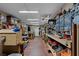 Organized workshop with long workbench and various tools at 13910 Max Hooks Rd, Clermont, FL 34711