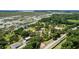 Aerial view of waterfront property with large lot and buildings at 13910 Max Hooks Rd, Clermont, FL 34711