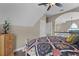 Large bedroom with a king-size bed and hardwood floors at 13910 Max Hooks Rd, Clermont, FL 34711
