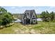 House with a lake view, showcasing a beautiful landscape at 13910 Max Hooks Rd, Clermont, FL 34711