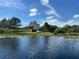 Lakefront home with a screened porch at 13910 Max Hooks Rd, Clermont, FL 34711