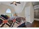 Upstairs bedroom with a king bed and access to a bathroom at 13910 Max Hooks Rd, Clermont, FL 34711